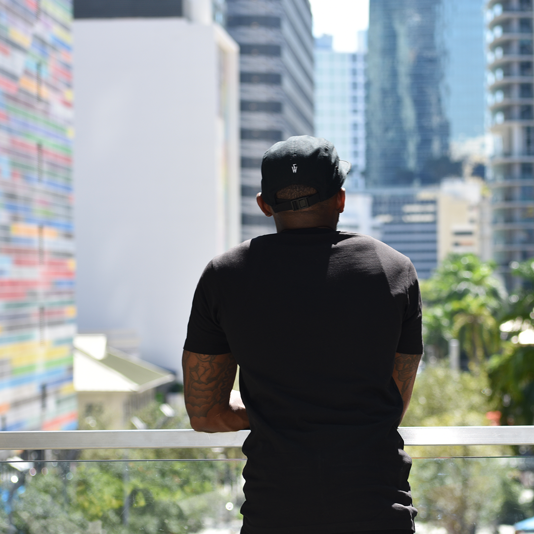 From Withn model in Black Signature Strapback Cap overlooking Brickell in Miami, FL
