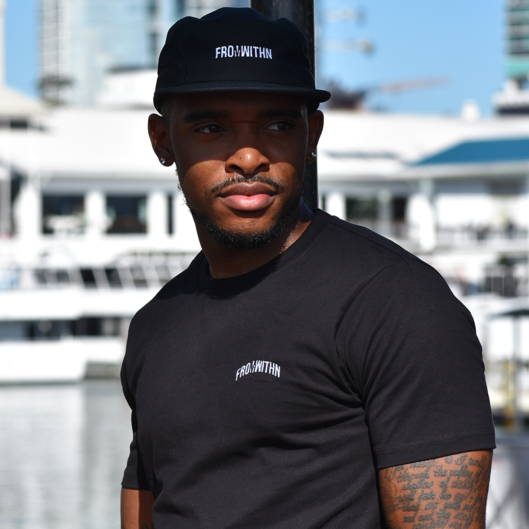 From Withn model in Black From Withn Signature Curve Tee and black strapback cap in Miami, FL